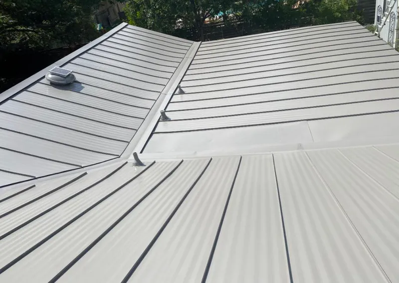 Solar attic fan installed on a metal roof for Roof Ventilation in Panama City Beach